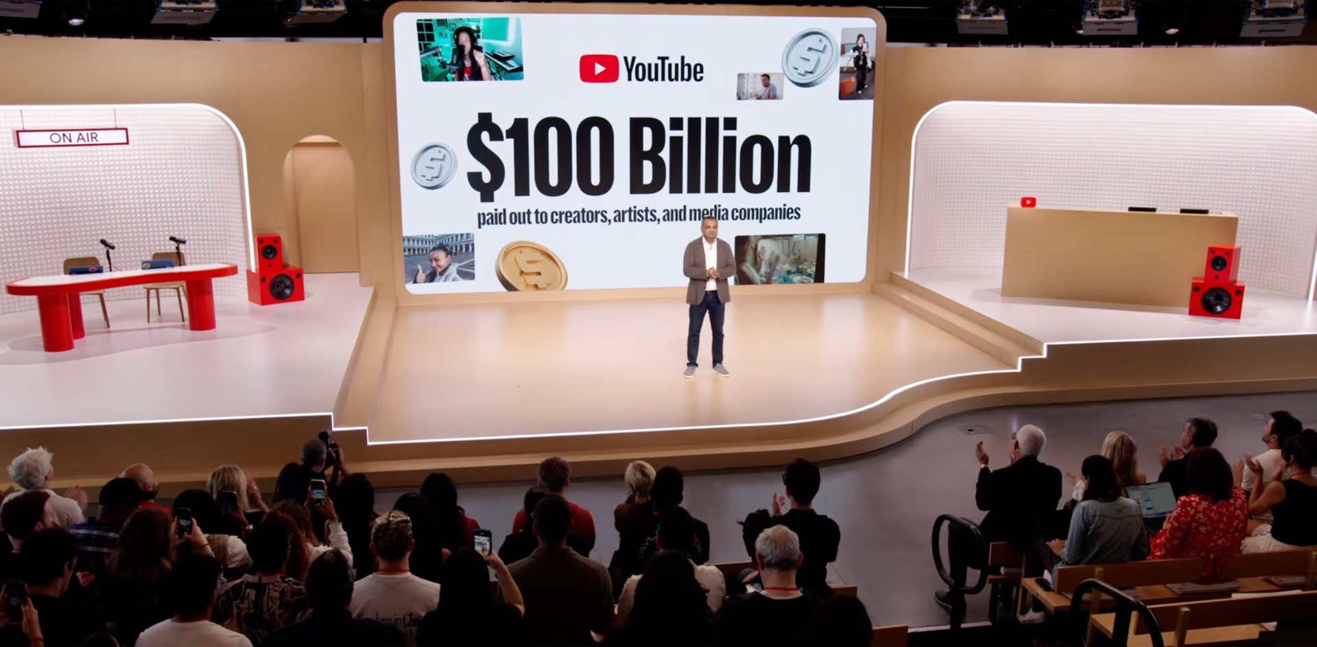 Made on YouTube event: stage presentation with speaker and YouTube $100 Billion screen